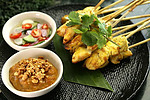 Satay with peanut sauce and pickled vegetables Satay with peanut sauce and pickled vegetables