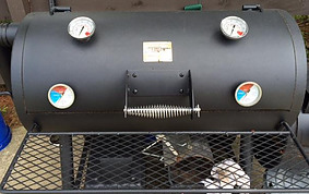 offset smoker with thermometers at cooking grate level