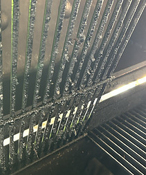 clean underside of cooking grate